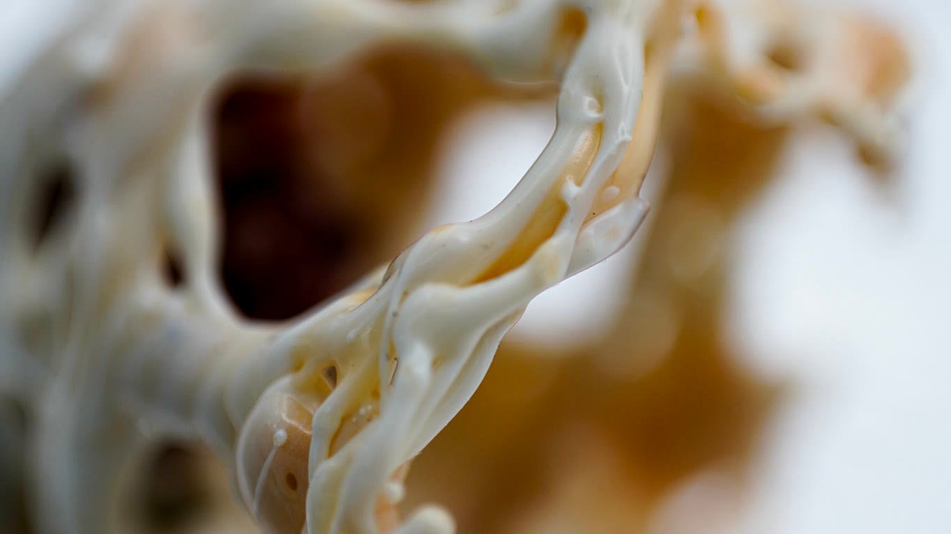 Extreme close-up of cream glass filaments and open holes